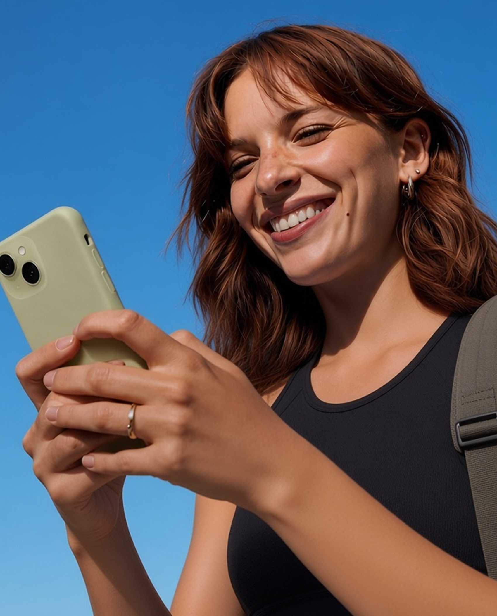 Trainer smiling at her phone